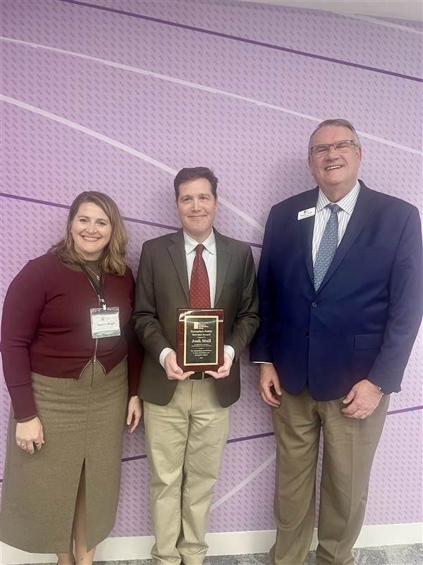 Image of Josh Stull with Award.