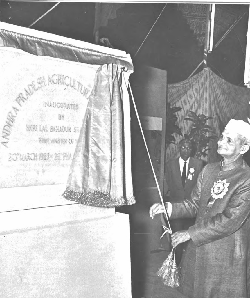 Black and white photo of the Indian prime minister revealing India's new land grant system.