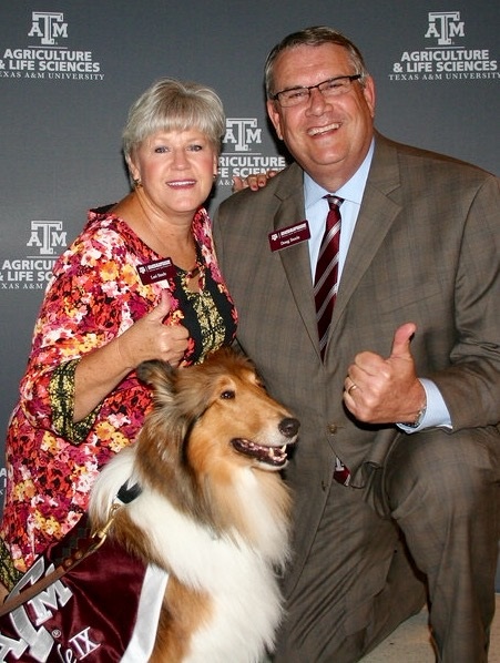 Doug Steele with wife Lori and TAMU mascot Reveille